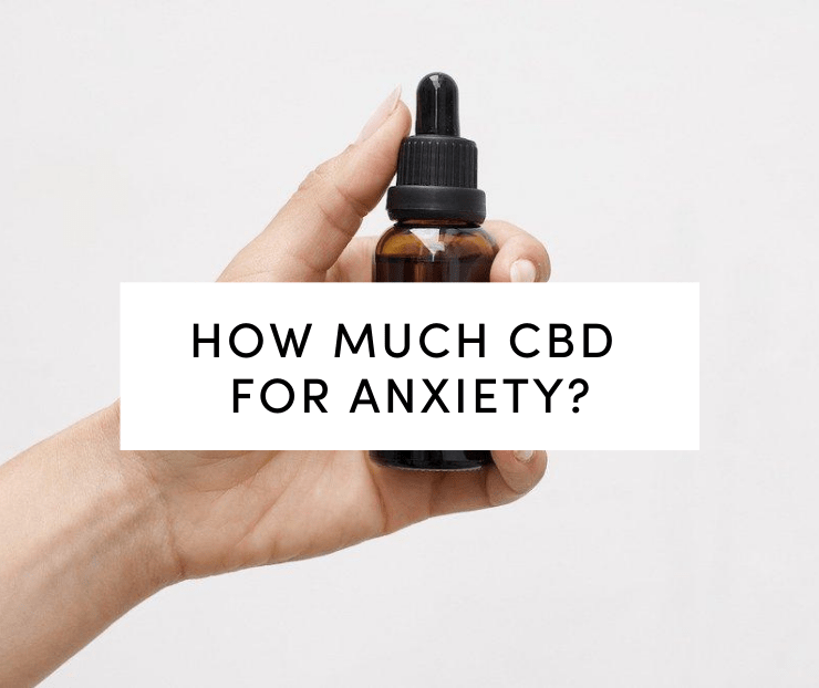 Woman holding CBD tincture in hand