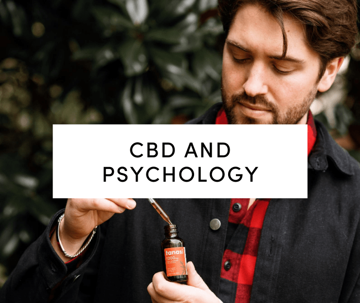 CBD and Psychology: Man outdoors holding Tanasi CBD tincture