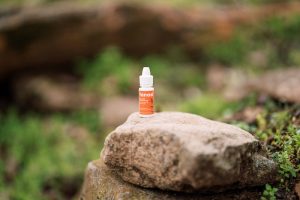 Tanasi CBD water soluble on rock 
