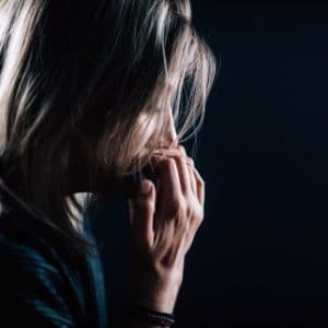 Can CBD Help with Anxiety? - women in the midst of an anxiety attack