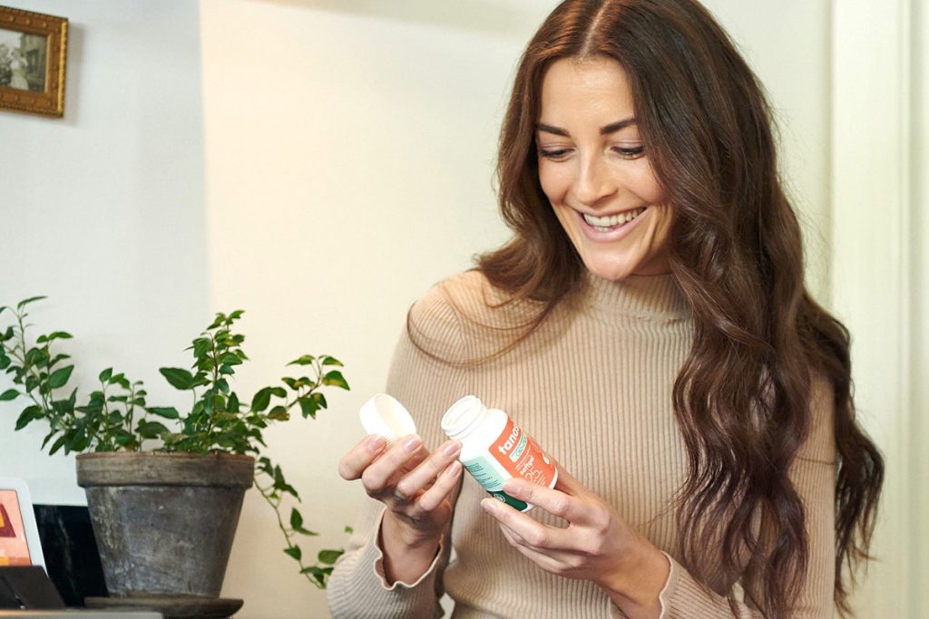 A woman enjoying the relief of CBD CBDA and omega-3